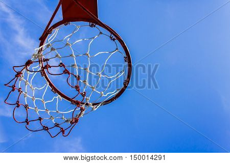 A view of a basketball hoop from below