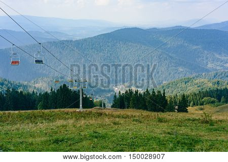 Lift In The Carpathians Among Spruce Trees