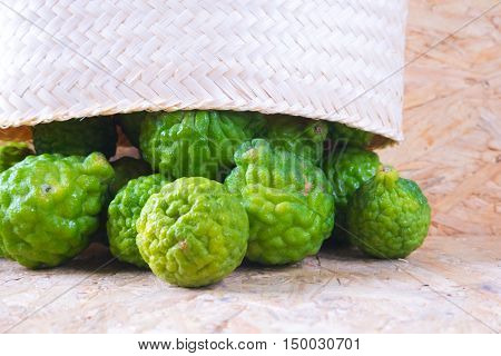 Pile of bergamot (Kaffir Lime) fruit on wood background