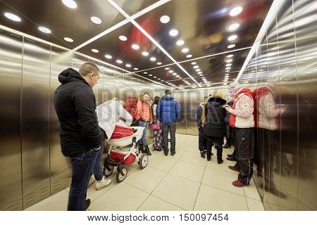 MOSCOW, RUSSIA - APR 02, 2016: Elevator cabin with passengers in Aviapark trade center at Hodynskiy boulevard.