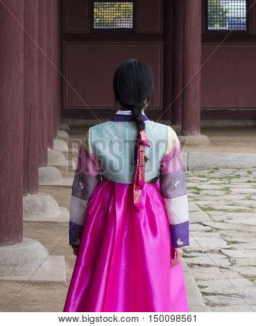 Beautiful girl in Hanbok at Gyeongbokgung, the traditional Korean dress