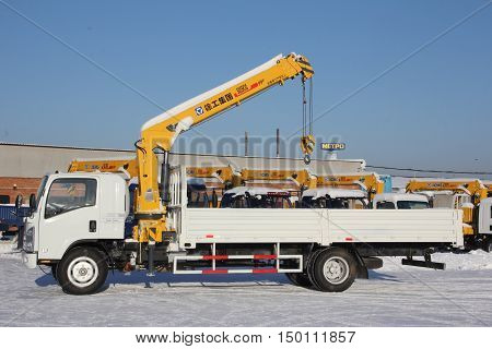 Great White Auto Truck Crane Standing On Construction Site In Winter - Russia, Crimea -january, 21,