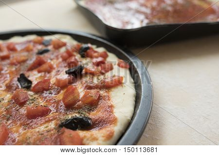 pizza alla marinara with fresh chopped tomatoes anchivies and black olives