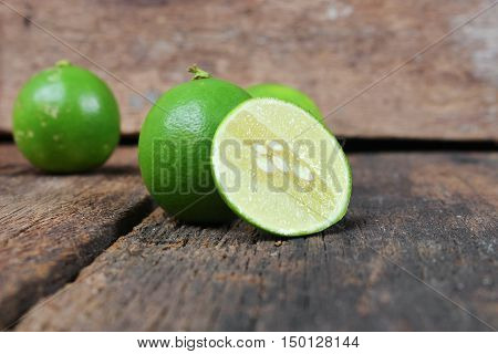 slice lemon closeup Select focus with shallow depth of field on the wooden table