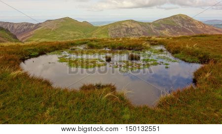 Hopegill Head and Grisedale Pike with tarn on Sail in foreground, Lake District, Cumbria, England