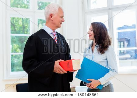 Lawyer and paralegal in their law office