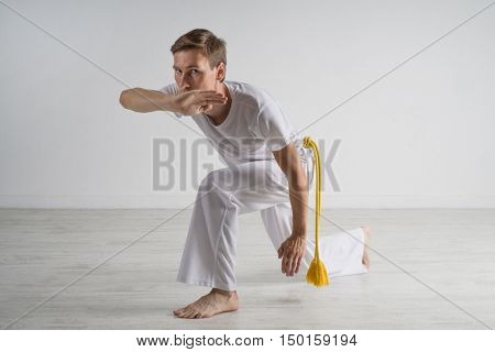 Man practicing capoeira , brazilian martial art.
