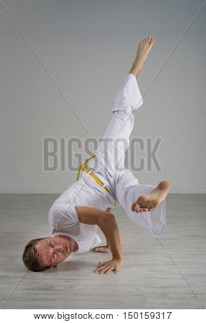 Man practicing Capoeira , brazilian martial Art.