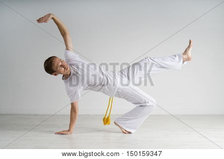 Man practicing Capoeira , brazilian martial Art.