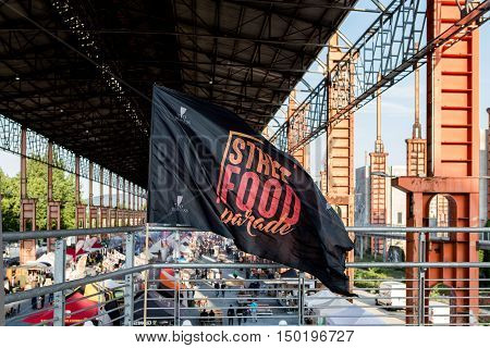 TURIN ITALY -JULY 01 2016: flag and view of the Street Food parade in Parco Dora park Turin Italy