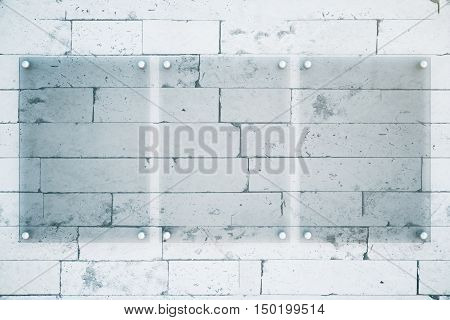 Front view of three blank glass plates on brick wall background. Mock up 3D Rendering