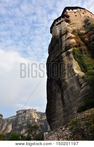 View from bottom on the Monastery Roussanov at sunrise Meteora Greece
