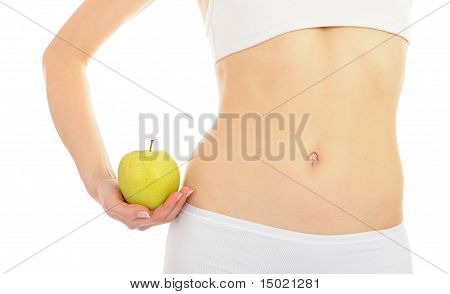 Donna con bel corpo tenendo una mela vicino alla vita sottile. Isolated On White Background