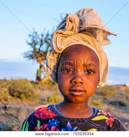LAKE EYASI, TANZANIA - MAY 29, 2015: Kids from a Datoga tribe playing at sunset at Lake Eyasi Tanzania