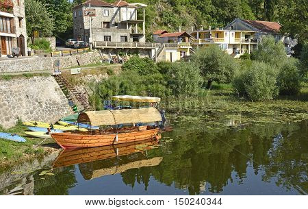 An old boat moored at Virpazar on Skadarsko Jezero or Lake Skadar in Montenegro.