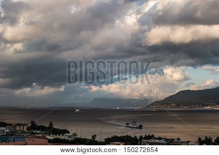 The Messina Strait seen from Sicily Italy. Beautiful moving clouds over vast spaces.