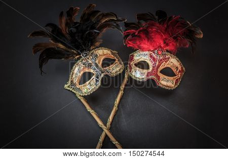 amazing beautiful closeup view of theatrical colorful masks on dark grey background