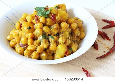 Indian, Pakistani, Nepali cuisine. Spicy chickpeas curry with potato