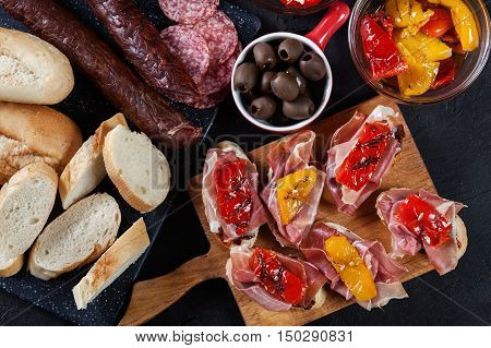 Spanish Tapas With Slices Jamon Serrano And Grilled Pepper. Also