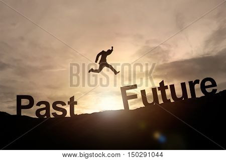 Silhouette of businessman glowing jump past to future. success concept