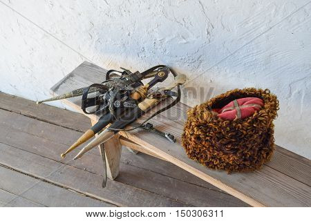 Several Daggers On A Bench Near A Cossack Hat