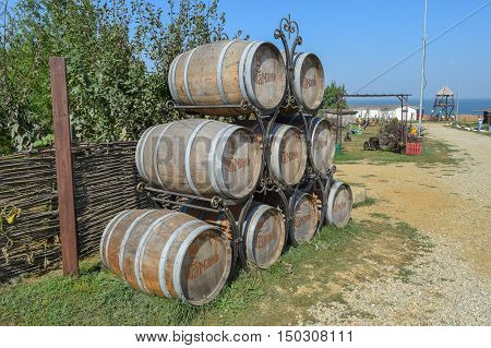 Stacked Wine Barrels. Decoration Of The Barrels In The Village Ataman.