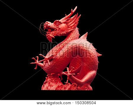 Chinese dragon statue isolated on black background.