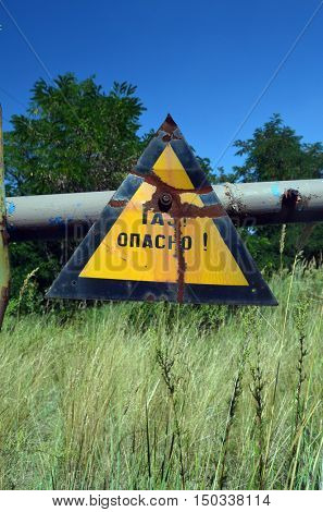 Gas -danger sign (RU). Ukrainian gas pump station entrance.August 5, 2016.Near Kiev,Ukraine