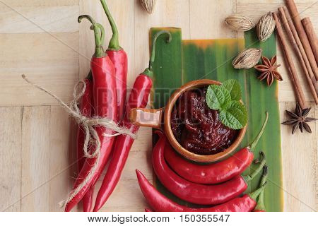 Korean red pepper gochujang for cooking on wood background