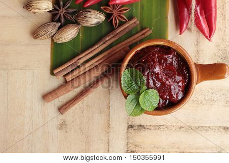 Korean red pepper gochujang for cooking on wood background
