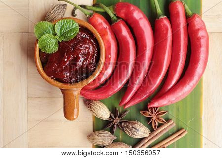 Korean red pepper gochujang for cooking on wood background