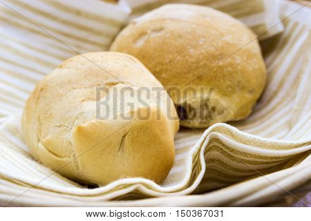 bread in basket - little roll breads in basket on table
