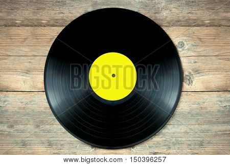 Close up of a vinyl record lp on a wooden table