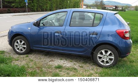 Blue Car Parked By The Street