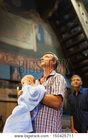 Chisinau MOLDOVA - September 10 2016: The Holy Orthodox rite of the sacrament of baptism newborn baby in a Christian Church.
