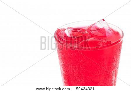 Closeup red soft drink with strawberry flavor in glass on white background
