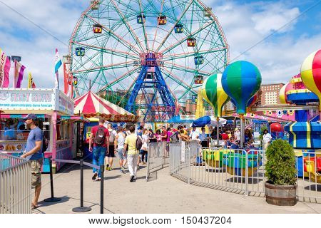 NEW YORK,USA - AUGUST 18,2016 : Ferris wheel and carrousel at the Luna Park amusement park at Coney Island