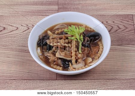 Mixed vegetable and tofu sheet (mushroom ,fermented flour,bamboo shoot,tapioca flour,celery in brown soup call 