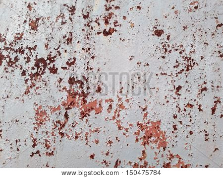 Weathered rusty metal texture. Grungy iron surface with old speckled paint.