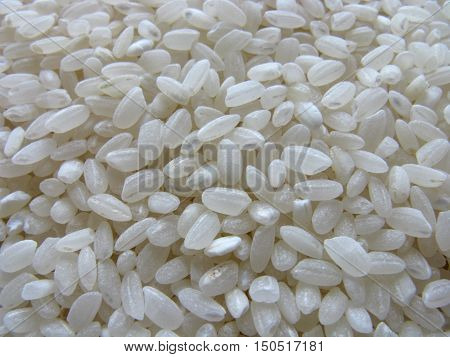 Dry rice. Rice background. A lot of dry rice (rice cereal). Scattered rice. Natural background.
