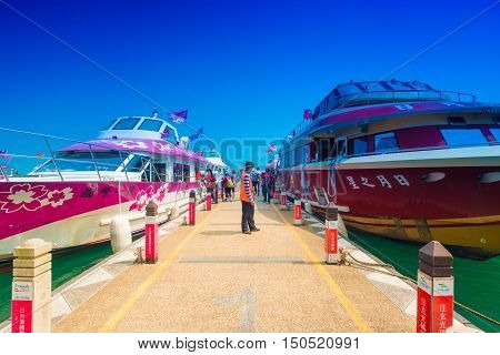SUN MOON LAKE - MARCH 20: Tourist with boats parking at the pier on March 20 2015 at Sun Moon Lake Taiwan. Sun Moon Lake is the largest body of water in Taiwan as well as a tourist attraction.