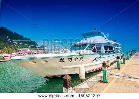 SUN MOON LAKE - MARCH 20: Tourist with boats parking at the pier on March 20 2015 at Sun Moon Lake Taiwan. Sun Moon Lake is the largest body of water in Taiwan as well as a tourist attraction.