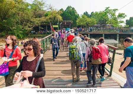 SUN MOON LAKE - MARCH 20: Tourist with boats parking at the pier on March 20 2015 at Sun Moon Lake Taiwan. Sun Moon Lake is the largest body of water in Taiwan as well as a tourist attraction.