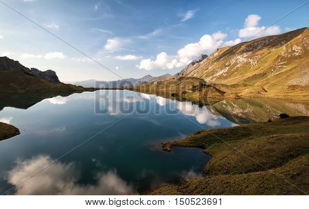 alpine lake with reflected blue sky Alps Germany