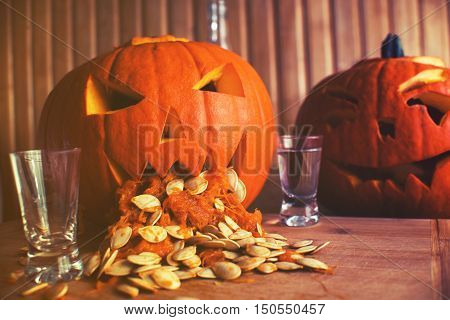 Pumpkin Puking With Pumpkin Seeds On Wood Table, Vodka, Vintage Effect