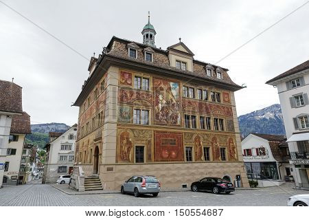 SCHWYZ SWITZERLAND - MAY 09 2016: The Town Hall of Schwyz was built in the 17th century. Its wall paintings was done to celebrate 600 years Swiss Confederation and it dates from the 19th century