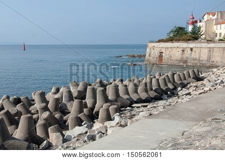 Concrete blocks tetrapod breakwater protect Ajaccio harbor, French island of Corsica