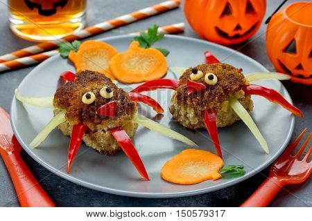 Funny food idea for kids spider meatballs with pumpkin slice garnish