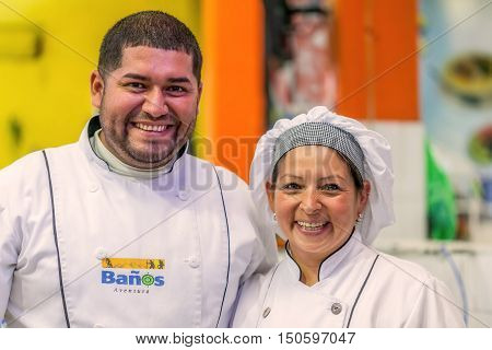 Banos De Agua Santa Ecuador - 23 June 2016: Unidentified Happy Chef Couple Or Cooks Smiling To The Camera Banos De Agus Santa Public Market Ecuador South America
