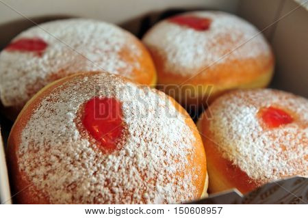 Fresh sufgniyot in a cardboard box for the Jewish holiday of Hanukkah